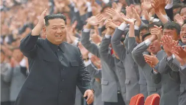  ?? KCNA / KNS / VIA AFP-JIJI ?? North Korean leader Kim Jong Un greets supporters in Pyongyang on May 1.