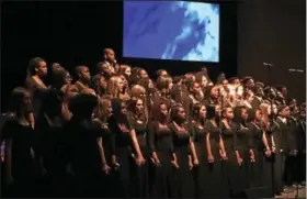  ?? REBECCA BLANCHARD — DIGITAL FIRST MEDIA ?? Choirs from both schools combined and held hands for the final selection of the night — “We Shall Overcome.”