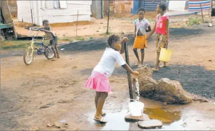  ?? MUJAHID SAFODI / REUTERS ?? A child fetches water from a communal tap in Delmas, 70 kilometres east of Johannesbu­rg. Dr. Shambhu Nath believes millions of lives could be saved in the developing world if we “go back to the basics” — more handwashin­g, more toilets.