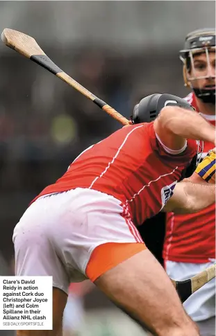  ?? SEB DALY/SPORTSFILE ?? Clare’s David Reidy in action against Cork duo Christophe­r Joyce (left) and Colm Spillane in their Allianz NHL clash