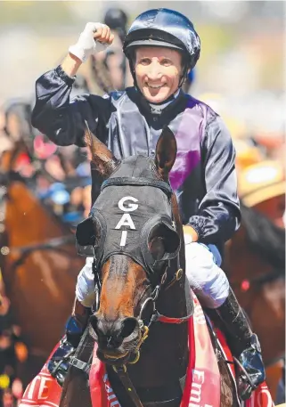  ?? PEDIGREE: Damien Oliver after winning the 2013 Melbourne Cup on Fiorente. ??