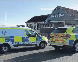  ?? Picture: George McLuskie. ?? Police vehicles at the Buck & Hind, where a man was stabbed and taken to hospital.