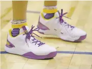  ??  ?? Ball wears the muchhyped $495 Big Baller Brand shoes as he waits for the start of the Lakers’ game Friday.