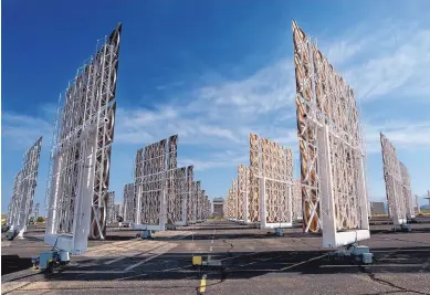  ?? JIM THOMPSON/JOURNAL ?? A field of 218 heliostats at Kirtland Air Force Base is made of mirrors whose purpose is to reflect the sun’s light. Sandia National Laboratori­es is using the tower to develop renewable energy.