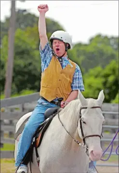  ?? SEAN D. ELLIOT/THE DAY ?? Above, Billy Lewis of Norwich lets out a shout of celebratio­n as he is awarded first place in the Horsemansh­ip Class Therapeuti­c Riding Horse Show on Sept. 9, 2005, at the Riverview Farms Country Fair in Montville.