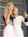  ?? Picture: PA. ?? Laura Dern, left, and Renee Zellweger show off their awards.