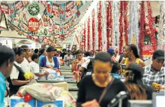  ?? Picture: MOELETSI MABE ?? ’TWAS THE MONTH BEFORE CHRISTMAS: Shoppers queue at till points inside the Checkers Hyper at Sandton City, Joburg, on Friday. Black Friday is becoming a popular feature on the retail calendar, when stores offer discounted bargains