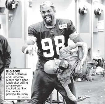  ??  ?? BIG BOO! Giants defensive end Damontre Moore has a good laugh after pulling a Halloweeni­nspired prank on the media at practice Thursday.