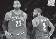  ?? AP FILE PHOTO ?? The Cavaliers’ LeBron James (left) and Kyrie Irving were teammates last season but will be rivals tonight after Irving was traded to the Celtics. Cleveland hosts Boston at 7 p.m. in the NBA season opener. Golden State hosts Houston in today’s other game.