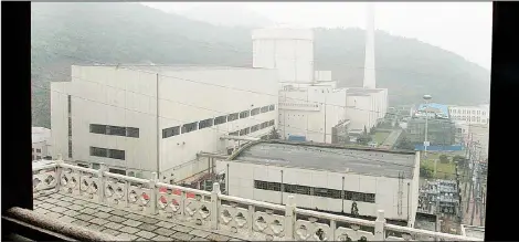  ??  ?? In this file photo, part of the Qinshan No. 2 Nuclear Power Plant, China’s first self-designed and self-built national commercial nuclear power plant, is seen through a Chinese style decoration in Qinshan, about 125 kms (about 90 miles) southwest of...