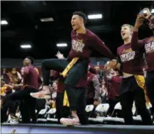  ?? ARMANDO L. SANCHEZ/CHICAGO TRIBUNE VIA AP ?? Loyola Chicago guard Marques Townes, center, celebrates with teammates after the Ramblers’ seed in the NCAA Tournament was revealed Sunday night.