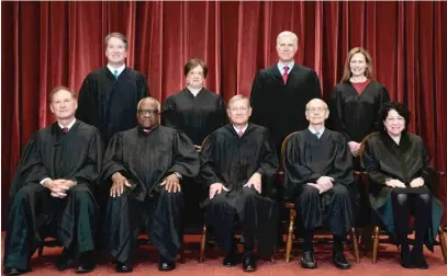  ?? POOL/AFP VIA GETTY IMAGES ?? Members of the Supreme Court: Seated from left, Associate Justice Samuel Alito, Associate Justice Clarence Thomas, Chief Justice John Roberts, Associate Justice Stephen Breyer and Associate Justice Sonia Sotomayor. Standing from left, Associate Justice Brett Kavanaugh, Associate Justice Elena Kagan, Associate Justice Neil Gorsuch and Associate Justice Amy Coney Barrett.