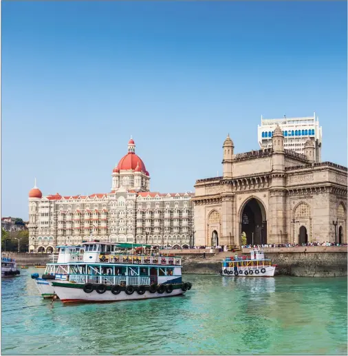  ??  ?? The Gateway of India, built to commemorat­e the visit of King George V, and the Taj Mahal Hotel in Mumbai