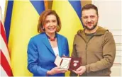  ?? UKRAINIAN PRESIDENTI­AL PRESS OFFICE VIA AP ?? Ukrainian President Volodymyr Zelenskyy, right, awards the Order of Princess Olga, the third grade, to U.S. Speaker of the House Nancy Pelosi in Kyiv, Ukraine, on Saturday. Pelosi is the highest-ranking American leader to visit Ukraine since the start of the war.