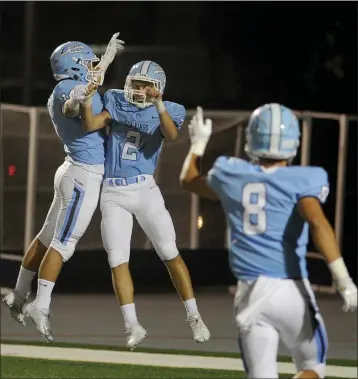  ?? PHOTO BY KENT TREPTOW ?? Corona del Mar’s Jack Elliott (2) celebrates with teammates after he returned an intercepti­on for a touchdown against El Toro at Newport Harbor High School in Newport Beach in 2018. He enrolled at TCU in 2019and died in October that year.