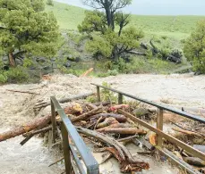  ?? NATIONAL PARK SERVICE ?? A washed-out bridge is shown last Monday from flooding at Rescue Creek in Yellowston­e National Park in Montana. The greatest damage seems to be roads.