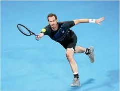  ?? GETTY IMAGES ?? Andy Murray stretches to make a forehand return during his men’s singles final loss to Russia’s Aslan Karatsev in the Sydney Tennis Classic, while below, Paula Badrosa celebrates after upsetting Barbora Krejcikova, of Czech Republic, in the women’s final.