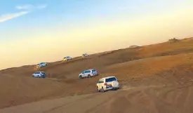  ??  ?? Dune bashing in Dubai’s desert at sunset