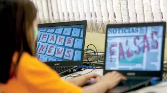  ?? AFP / Miguel Schincario­l ?? Students of Unified Educationa­l Centers (CEU) attend a lesson on 'Fake News: access, security and veracity of informatio­n', in Sao Paulo, Brazil on June 21, 2018. Media analysis is a compulsory subject in Brazilian schools.