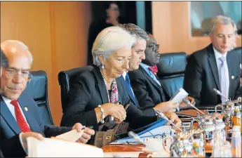  ?? Picture: GETTY IMAGES ?? GROWING ECONOMIC FEARS: Managing director of the Internatio­nal Monetary Fund Christine Lagarde, centre, at a meeting with German businessme­n. The IMF has warned that time is slipping away for South Africa if public sector debt continues to spiral out...