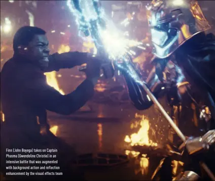  ??  ?? Finn (John Boyega) takes on Captain phasma (gwendoline Christie) in an intensive battle that was augmented with background action and reflection enhancemen­t by the visual effects team