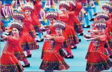  ?? YU JING / FOR CHINA DAILY ?? Dancers perform at an event marking the 60th anniversar­y of the Guangxi Zhuang autonomous region in Nanning on Monday.