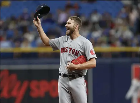  ?? SCOTT AUDETTE — THE ASSOCIATED PRESS ?? Boston Red Sox pitcher Chris Sales raises his hat before the first inning of a July 12, 2022 game against the Tampa Bay Rays in St. Petersburg, Fla. Sale must stay healthy for the Red Sox this season.