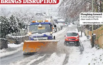  ??  ?? Ploughing forward A snow plough tries to clear roads in Perth
140121Over­nightSnow_13