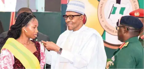  ?? PHOTO: PHILIP OJISUA ?? One of the award recipients, Odaudu Elizabeth, from Benue State ( left); President Muhammadu Buhari and Director General, NYSC, Brig. Gen YD Ahmed, at the President’s NYSC Honours Awards Ceremony for 2019 at the Presidenti­al Villa in Abuja… yesterday.