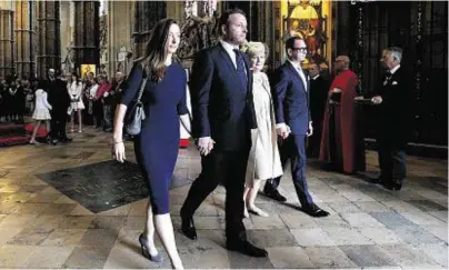  ??  ?? FAMILY: Widow Lady Helen Wogan flanked by children, from left, Katerine, Alan and Mark leave ceremony