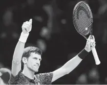  ?? ASSOCIATED PRESS FILE PHOTO ?? From left, Novak Djokovic of Serbia and Switzerlan­d’s Roger Federer are on opposite sides of the draw for the Australian Open.