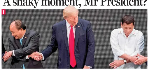  ??  ?? Now, how does this work? Donald Trump offers Mr Phuc the wrong hand, leaving his host Mr Duterte grasping air