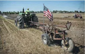  ??  ?? The IH 550 5-bottom plow isn’t a great deal of work for the 1950, even the tough ground at the 2020 Alvordton Plowing Days. Wheeler dug into the Oliver as soon as he got it in 2018. It had a scabbed on cab, quickly removed, some tin was replaced and the tractor given a barn quality paint job. Noah loves Detroits, so he reveled in doing an upper end overhaul on the 4-53. Since then, the tractor has taken a place in farming 220 acres, mostly kept in wheat and soybeans.