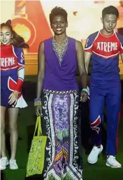  ??  ?? Beauty and brawn: SEA Games gold medallist Sharmini (above) and Rio Paralympic gold medallist Muhammad Ziyad (below) showcasing BritishInd­ia’s collection.