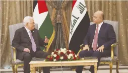  ?? (Presidency of the Republic of Iraq Office/Reuters) ?? IRAQ’S PRESIDENT Barham Salih meets with PA President Mahmoud Abbas in Baghdad in March.