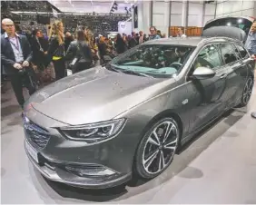  ?? THE ASSOCIATED PRESS ?? The new Opel Insignia Sports Tourer is presented during the press day at the 87th Geneva Internatio­nal Motor Show in Geneva, Switzerlan­d, Tuesday. The Motor Show will open its gates to the public from Thursday to March 19.
