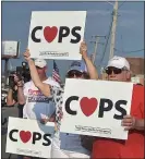  ?? MEDIANEWS GROUP FILE PHOTO ?? Nick Finelli of Havertown and other supporters wave posters supporting police at a June demonstrat­ion in Upper Darby.