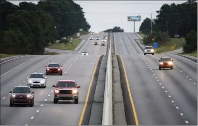  ?? AP/SEAN RAYFORD ?? Traffic moves west Tuesday on all lanes of Interstate 26 in Columbia, S.C., after the eastbound lanes were reversed to allow people to flee coastal areas.