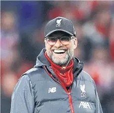  ??  ?? Liverpool manager Juergen Klopp smiles during a recent match.