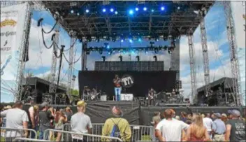  ?? PETE BANNAN – DIGITAL FIRST MEDIA ?? Delaware native Jimmie Allen entertains the crowd on the main stage at the Citadel Country Spirit USA Festival at Ludwig’s Corner show grounds Saturday.