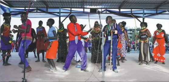  ?? PHOTOS BY WU XIAOHUI / CHINA DAILY ?? Performers and the audience dance together on stage during the Turkana Tourism and Cultural Festival in Lodwar, Kenya, on Oct 12.