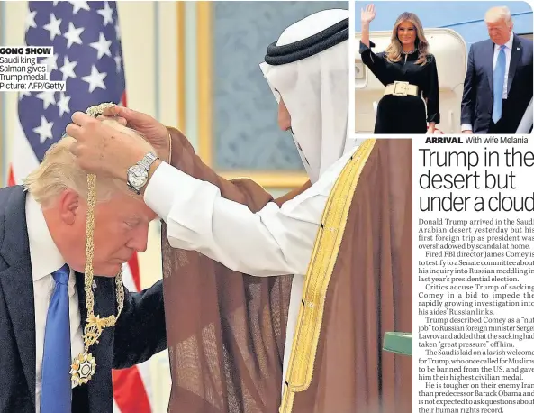  ??  ?? GONG SHOW Saudi king Salman gives Trump medal. Picture: AFP/Getty ARRIVAL With wife Melania