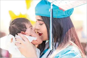  ??  ?? LEFT: Lizeth Mireles embraces her baby girl, Reina, following Capital High School’s commenceme­nt ceremony last month.