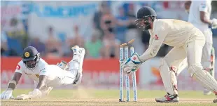  ??  ?? England wicketkeep­er Ben Foakes runs out Rangana Herath on his final appearance for Sri Lanka in the first Test in Galle.