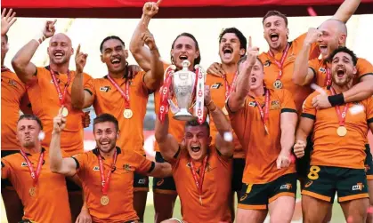  ?? Patrick T Fallon/AFP/Getty Images ?? Australia's rugby sevens team celebrate with the World Series trophy after defeating Samoa in their bronze medal match. Photograph:
