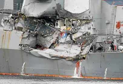  ?? REUTERS ?? CRUMPLED The side of the Aleigh Burke-class guided missile destroyer USS Fitzgerald is damaged after colliding with a Philippine-flagged merchant ship.