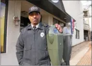  ?? FRAN MAYE – DIGITAL FIRST MEDIA ?? Andre Davenport, a Kennett Square parking enforcemen­t officer, stands next to a parking meter off of Union Street. The cost for parking meters will rise to $1 per hour in January.