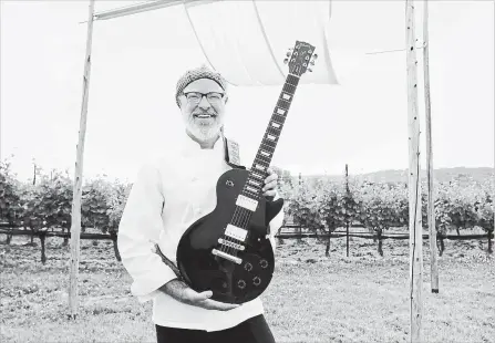  ??  ?? Ross Midgley, executive chef at Ravine Vineyards, is a passionate musician. He and few others in Niagara’s hospitalit­y industry play in a cover band called The Hopyards.