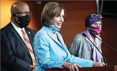  ?? SUSAN WALSH / AP ?? House Speaker Nancy Pelosi, center, flanked by Rep. Benny Thompson, D-Miss., left, and Rep. Rosa DeLauro, D-Conn., right, talks to reporters on Capitol Hill in Washington on Wednesday about legislatio­n to create an independen­t, bipartisan commission to investigat­e the Jan. 6 attack on the United States Capitol Complex. Thompson is chairman of the House Homeland Security Committee and negotiated a bipartisan bill outlining a commission to investigat­e the Jan. 6 attack on the Capitol.