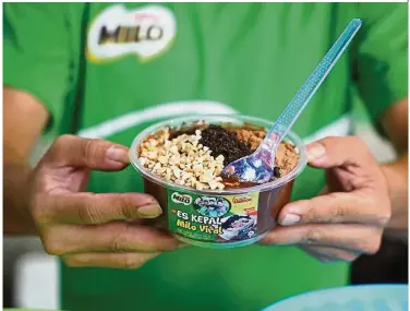  ?? — Bloomberg ?? High demand: The craze for Es Kepal Milo has spawned more than 17,000 ‘how-to-make’ videos from Indonesia alone, with millions of hits on YouTube.